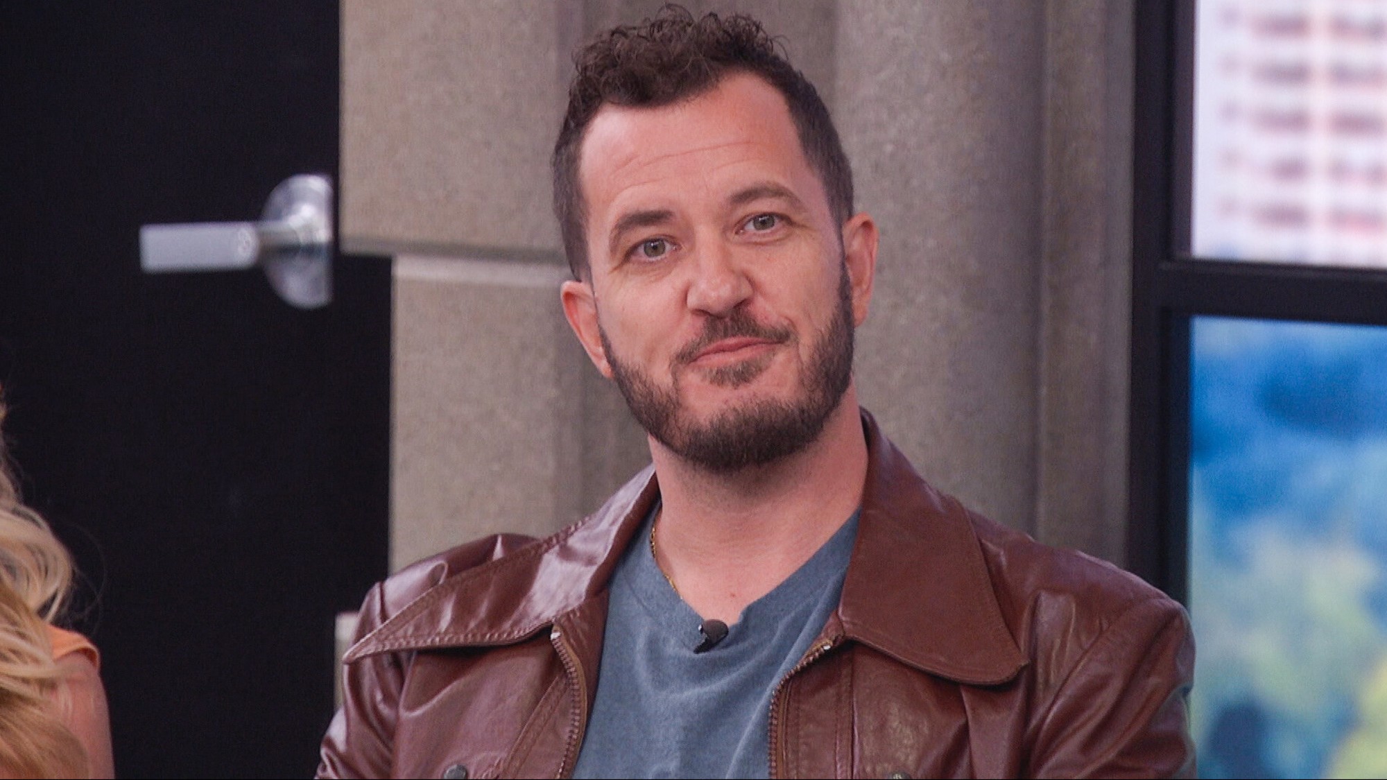 Rick Devens in a brown leather jacket.