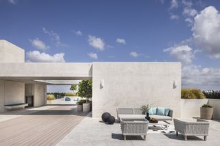 outdoors seating at Fairchild Grove housing by Strang Design and Rafael de Cárdenas