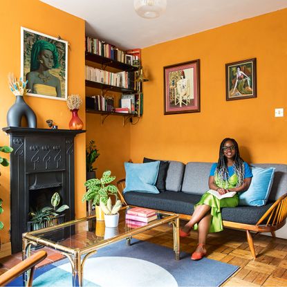 orange living room with home owner