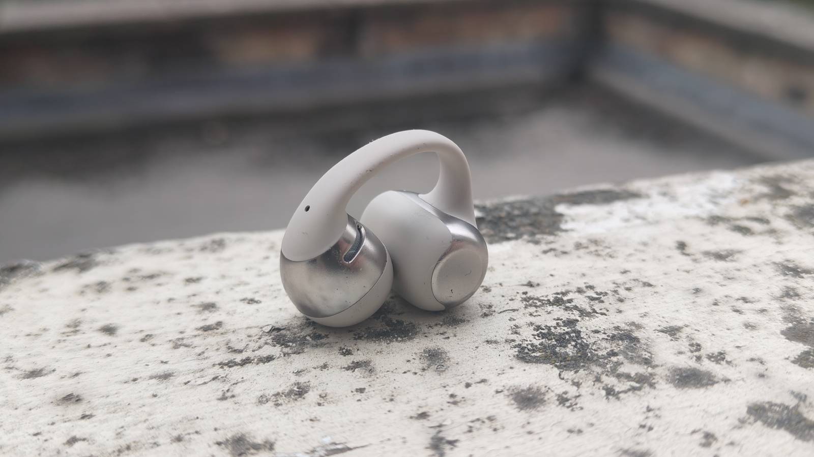 The Shokz OpenDots One on a white windowsill
