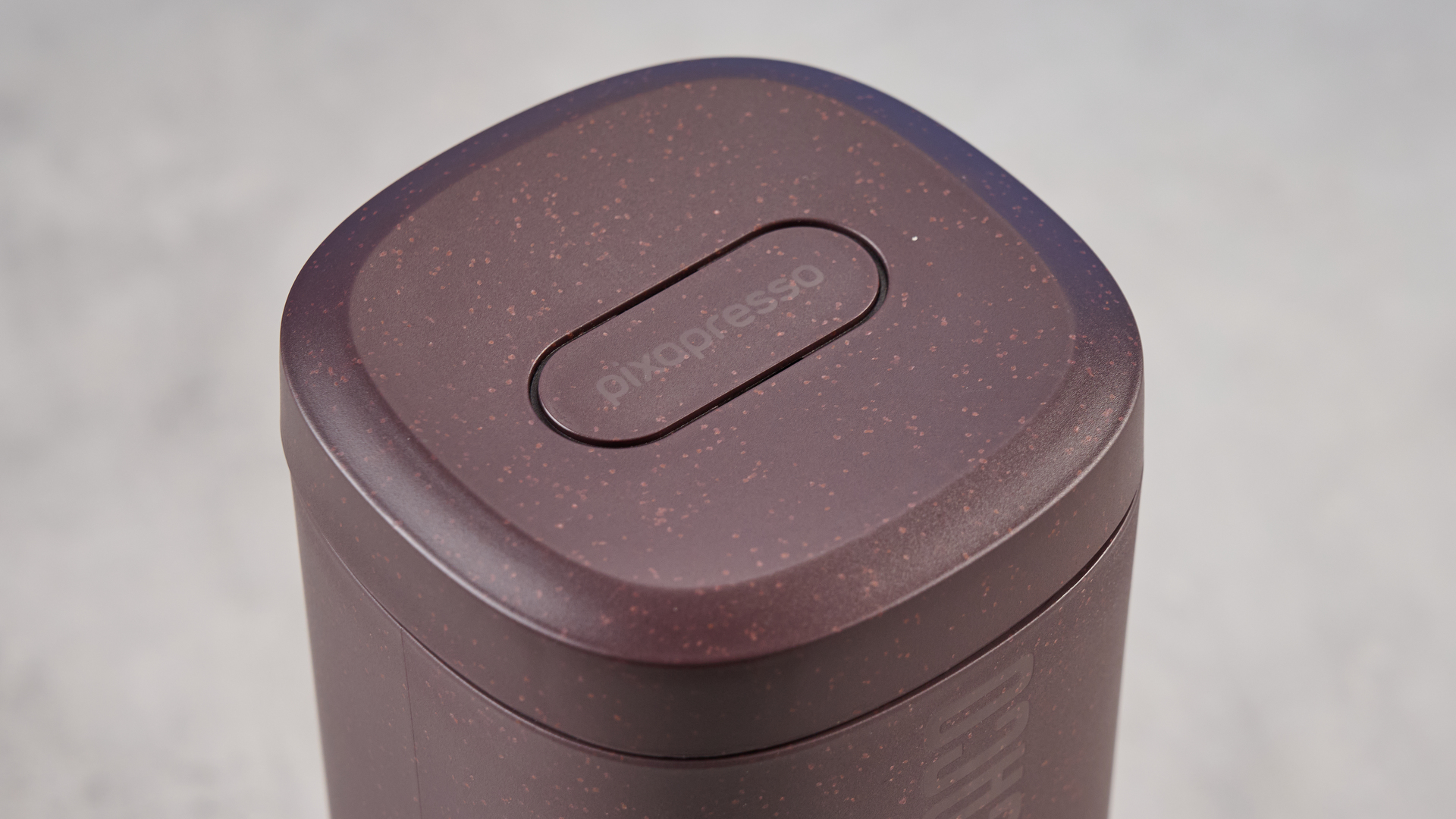 the wacaco pixapresso portable self-heating espresso maker in dark purple color showing usability with nespresso pods and ground coffee, ideal for vacations and camping