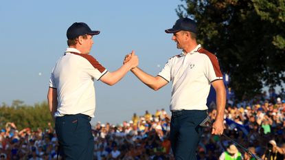 Robert MacIntyre and Justin Rose shake hands at the 2023 Ryder Cup