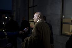 Bill Cosby leaves a courthouse