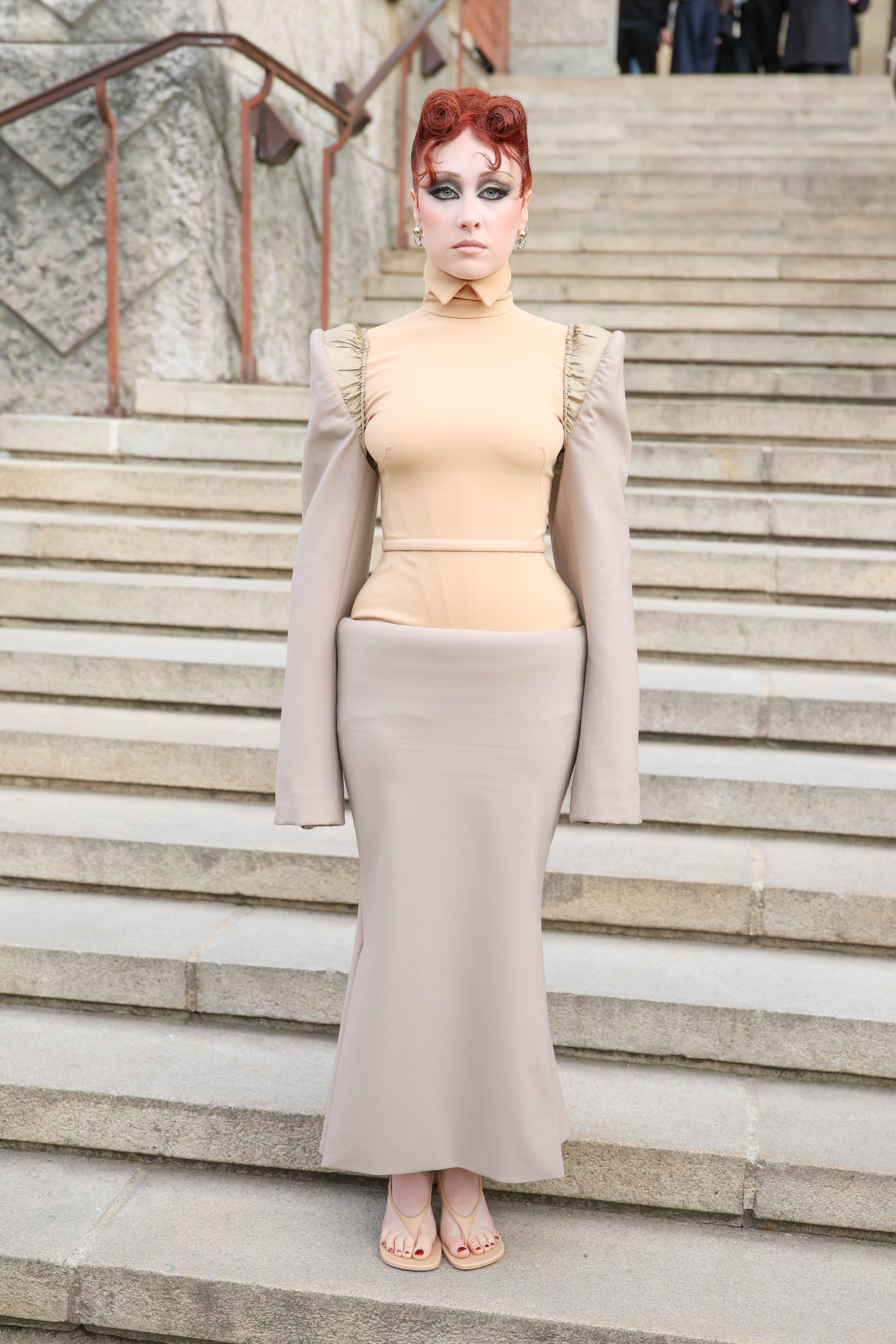 Chappell Roan attended the Mugler Fall 2026 in a nude two-tone skirt set