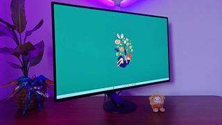 Sony Inzone M10S monitor tilted to right with green Kiki's Delivery Service wallpaper on screen