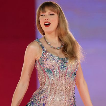 Taylor Swift onstage at the Eras Tour wearing a Versace bodysuit to illustrate a guide to her Eras Tour rehearsal outfits