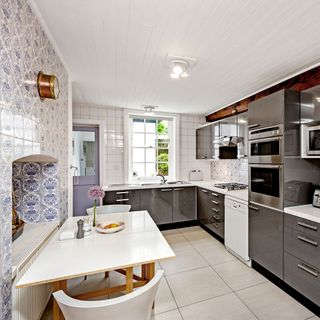 kitchen with delft tiles and cabinet