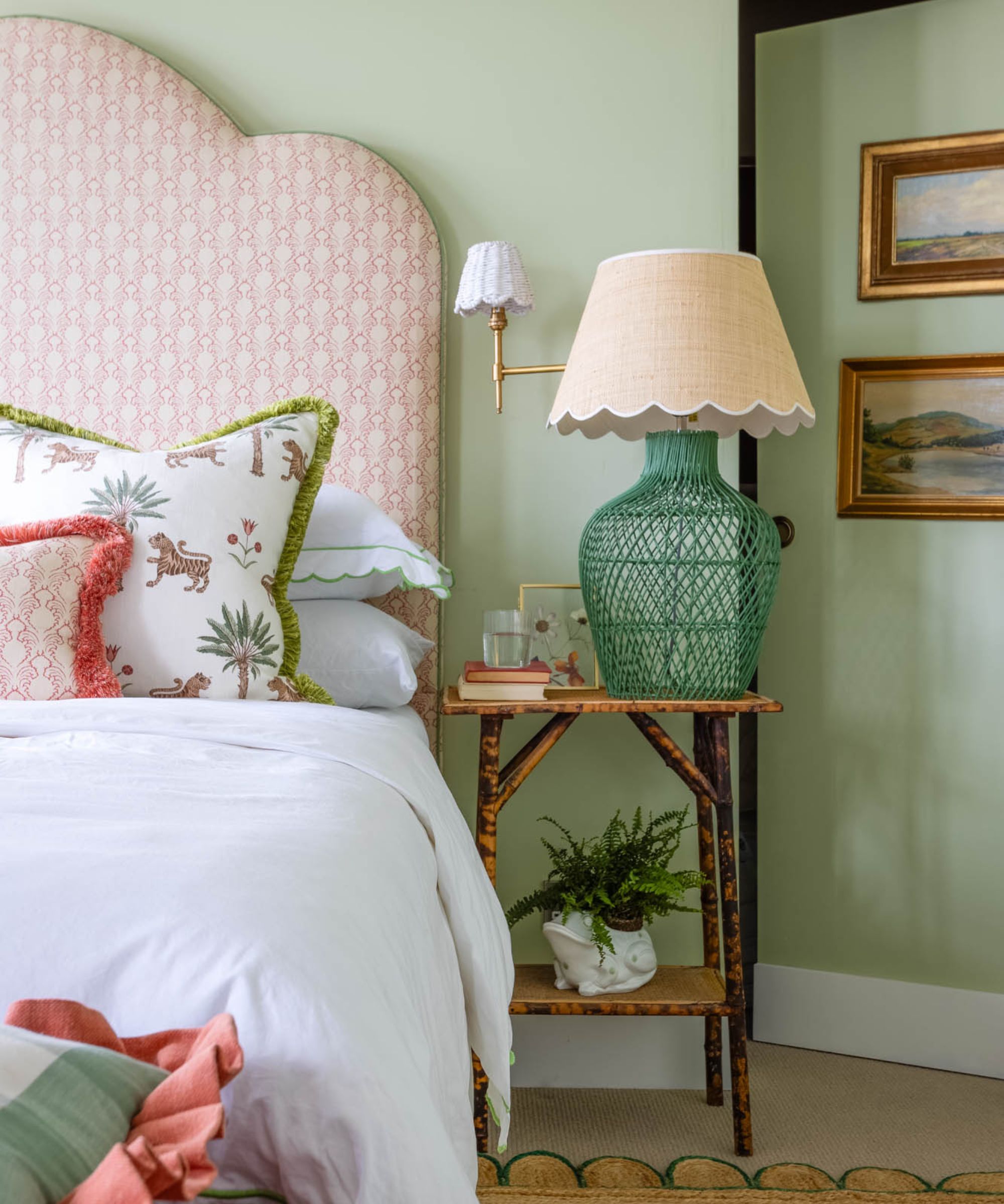 green bedroom with pink bed