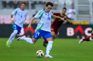 Italy forward Federico Chiesa (14) kicks the ball during the Italy vs. Venezuela International Friendly match on March 21, 2024, at Chase Stadium in Fort Lauderdale, Fla. (Photo by Doug Murray/Icon Sportswire via Getty Images)