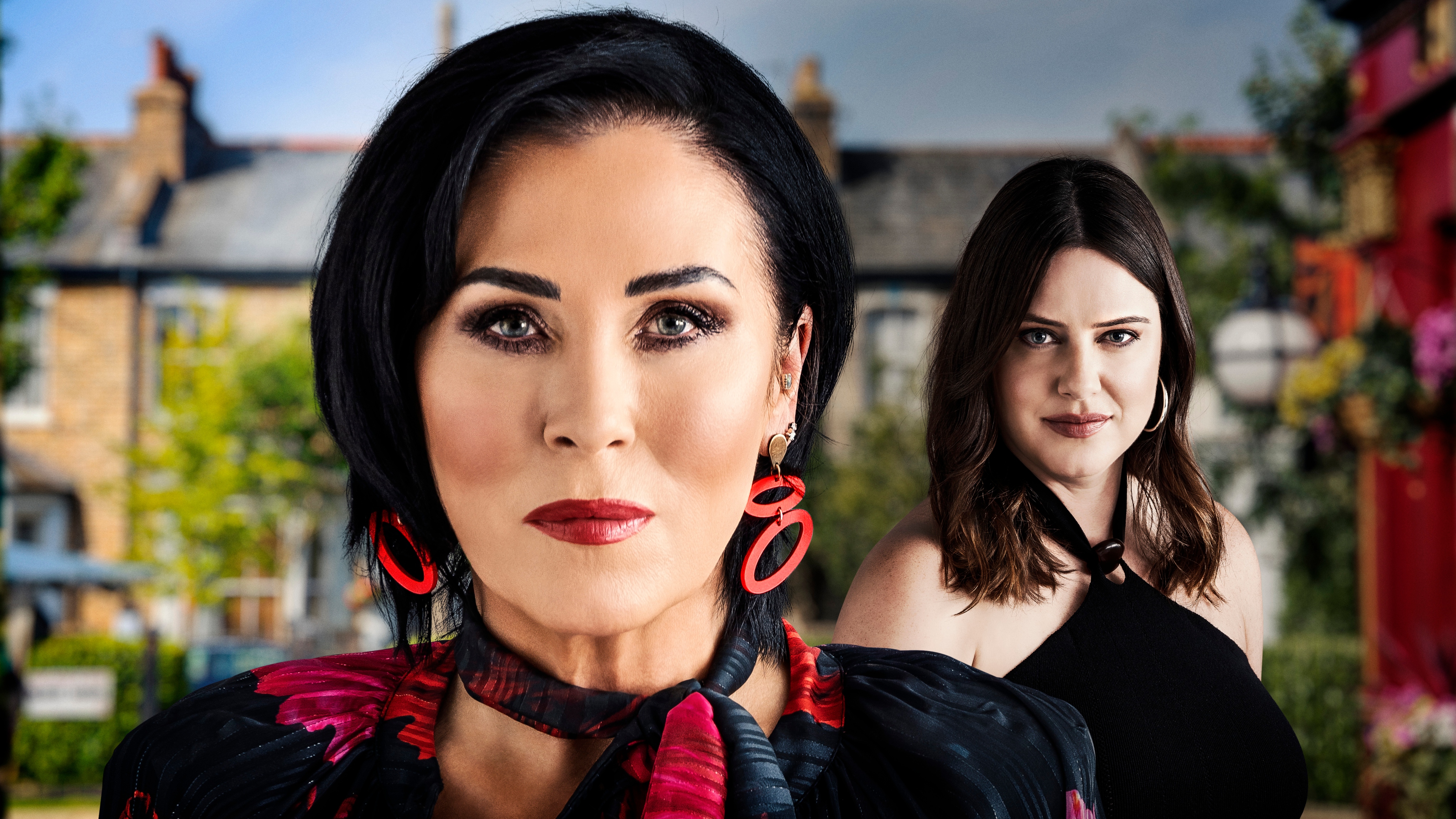 Press shot of Kat looking at the camera, with Zoe standing behind her.