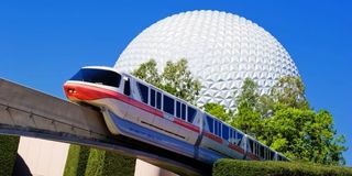 Monorail moving in front of Spaceship Earth at Epcot