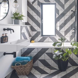 Tiled black and grey bathroom