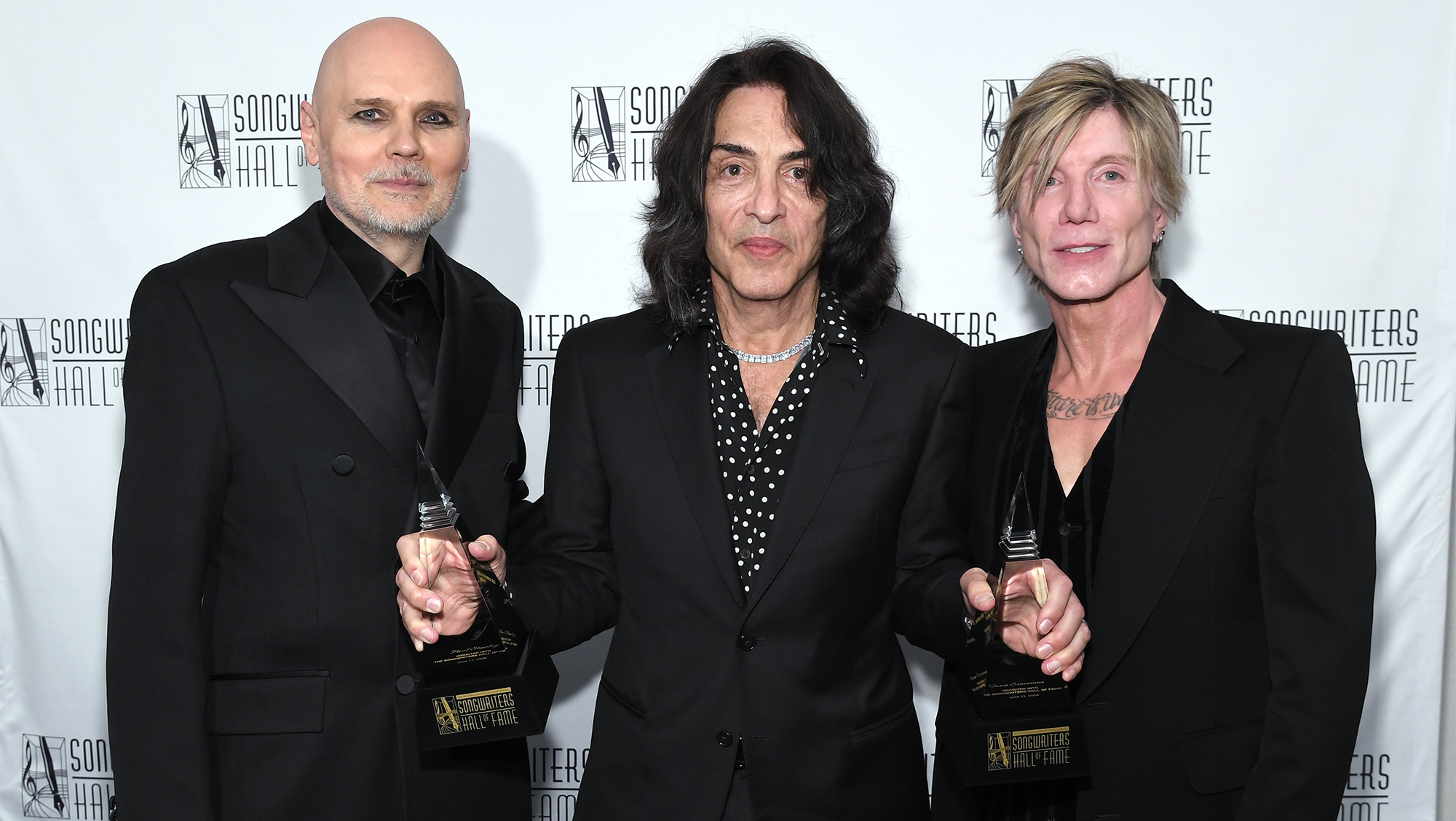 Billy Corgan, Paul Stanley, and John Rzeznik pose backstage during the 2026 Songwriters Hall Of Fame Induction Ceremony at The New York Marriott Marquis on June 11, 2026 in New York City.