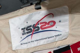 “ISS 20: 20 Years on the International Space Station" flag on board the International Space Station.