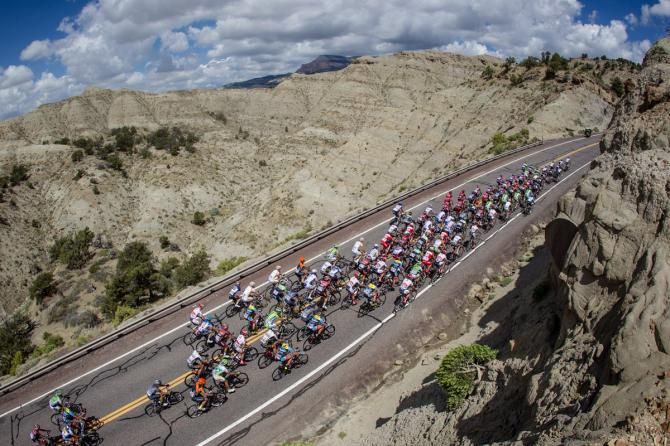 The peloton climbs up past Grand Staircase Escalante park