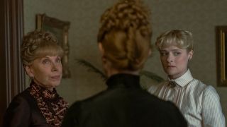 Christine Baranski and Louisa Jacobson stand looking upset in the living room in The Gilded Age S3 E1 - "Who Is In Charge Here?"