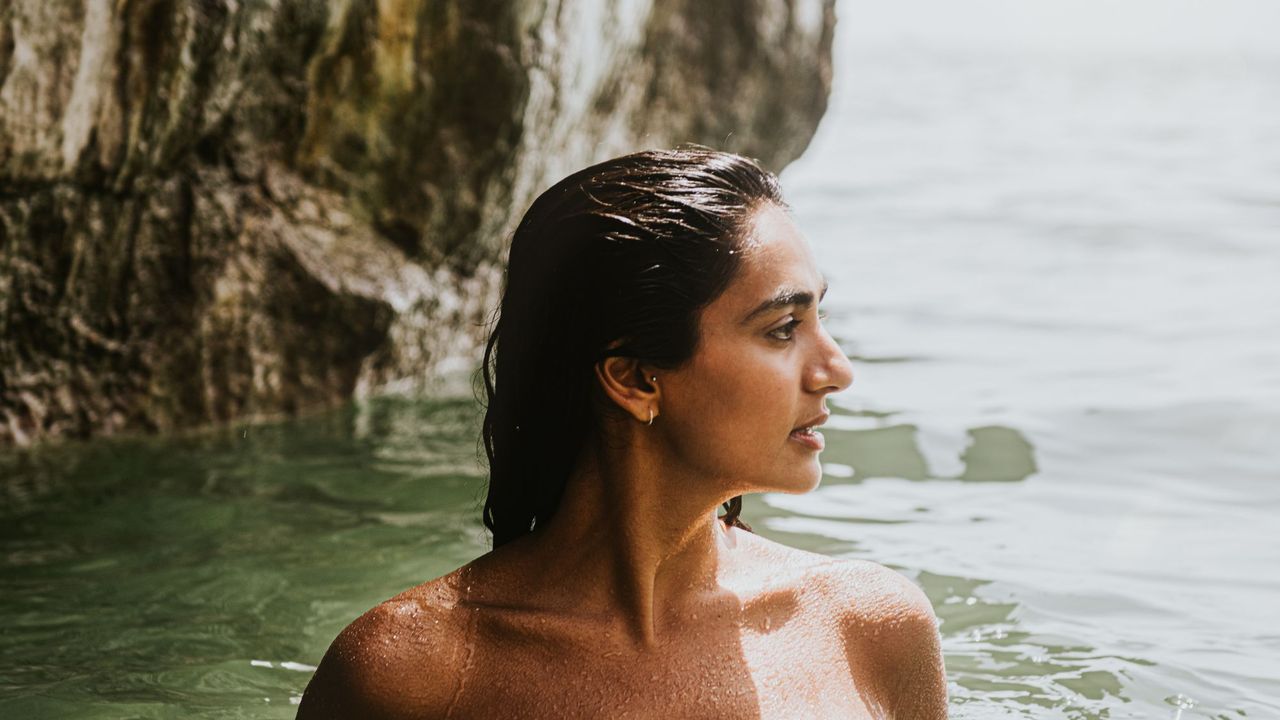 scalp sunscreens - woman with wet hair in the sea