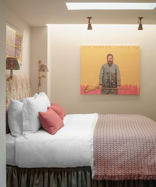 Pink bedroom with artwork on walls