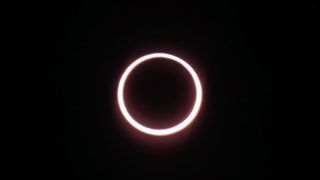 a glowing ring of light against a black background as the annular solar eclipse reaches peak annularity from Antarctica.