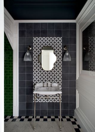 a bathroom with a mosaic tile floor