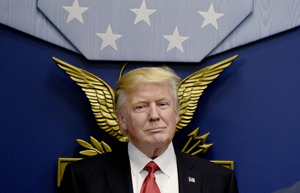 U.S. President Donald Trump sits during a meeting to sign executive orders 