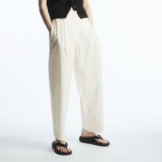 model wearing cos tailored chino trousers