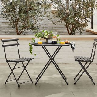 folding table and chairs on a patio