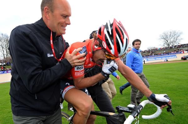 Bjarne Riis clutches Fabian Cancellara as the Swiss bursts into tears after winning Paris-Roubaix