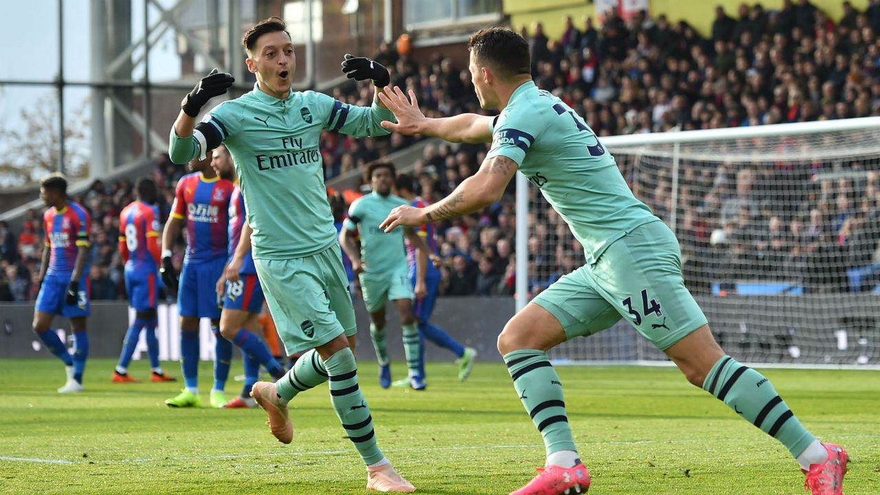 Mesut Ozil and Granit Xhaka celebrate a goal for Arsenal 