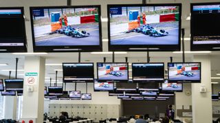 A2RL race car on TV monitors at Suzuka