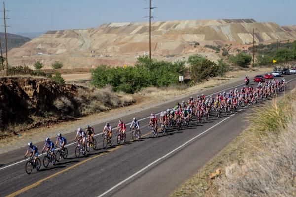 The peloton passes the Santa Rita Mine on the way out of town.