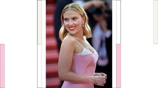 Scarlett Johansson wearing a pink satin dress with an exposed bra detailing at Cannes Film Festival 2023. Red carpet Asteroid City. Cannes (France), May 23rd, 2023