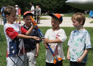 Amateur Rocketeers Check Out Their Model