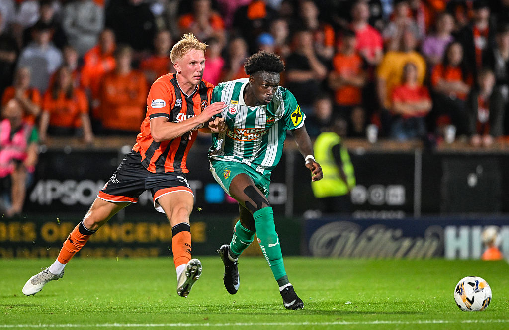 Dundee United's Own Stirton (L) and Rapid Wien's Serge-Philippe Raux-Yao (R) in action during a UEFA Conference League Third Qualifying Round second leg match between Dundee United and SK Rapid Wien at the CalForth Construction Arena at Tannadice Park, on August 14, 2025, in Dundee, Scotland.