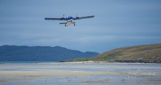 Plane coming in to land on Barra Island