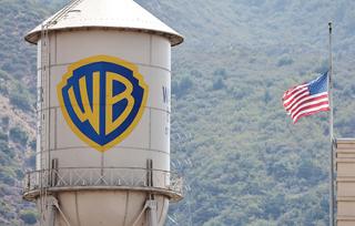 BURBANK, CALIFORNIA - SEPTEMBER 12: An American flag flies at Warner Bros. Studio on September 12, 2025 in Burbank, California. Media giant Paramount Skydance is reportedly preparing a bid to purchase Warner Bros. Discovery, including its movie studio and cable networks. (Photo by Mario Tama/Getty Images)