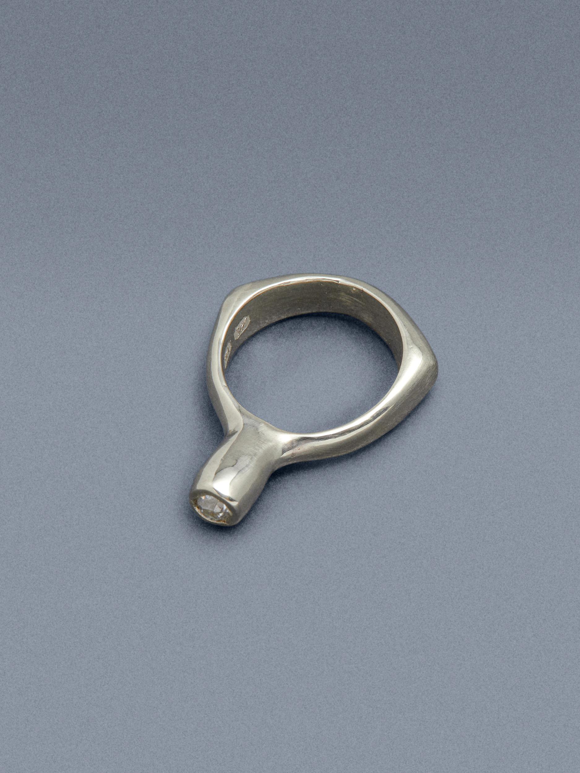 gold and silver jewellery against coloured backgrounds
