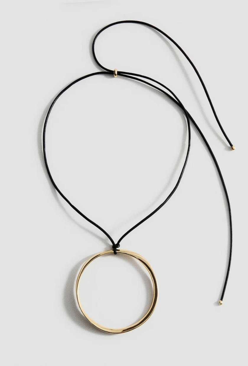 An image of a circular gold pendant necklace from Mango. 