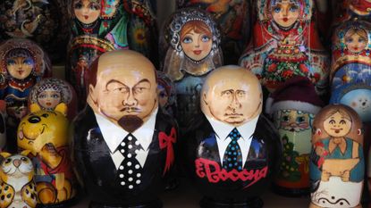 Painted Matryoshka dolls, also known as Russian nesting dolls, depicting Vladimir Lenin and Vladimir Putin