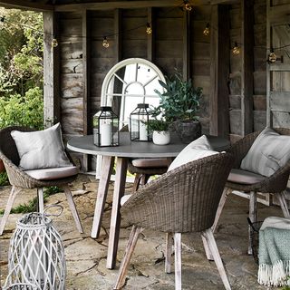 Outdoor Christmas lighting ideas with dining table and chairs and mirror