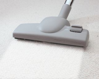 Vacuuming white carpet