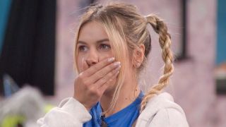 Leah Peters puts her hand over her mouth while looking at the nominations