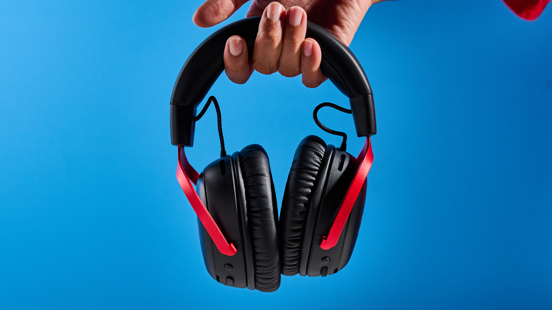 A black and red HyperX Cloud III S Wireless gaming headset