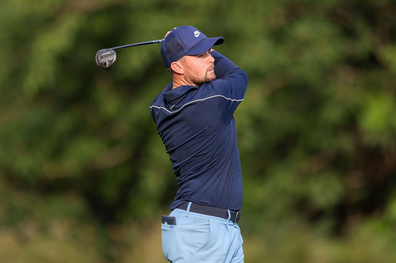 Alex Fitzpatrick plays his approach on hole 18 on day three of the Hero Indian Open