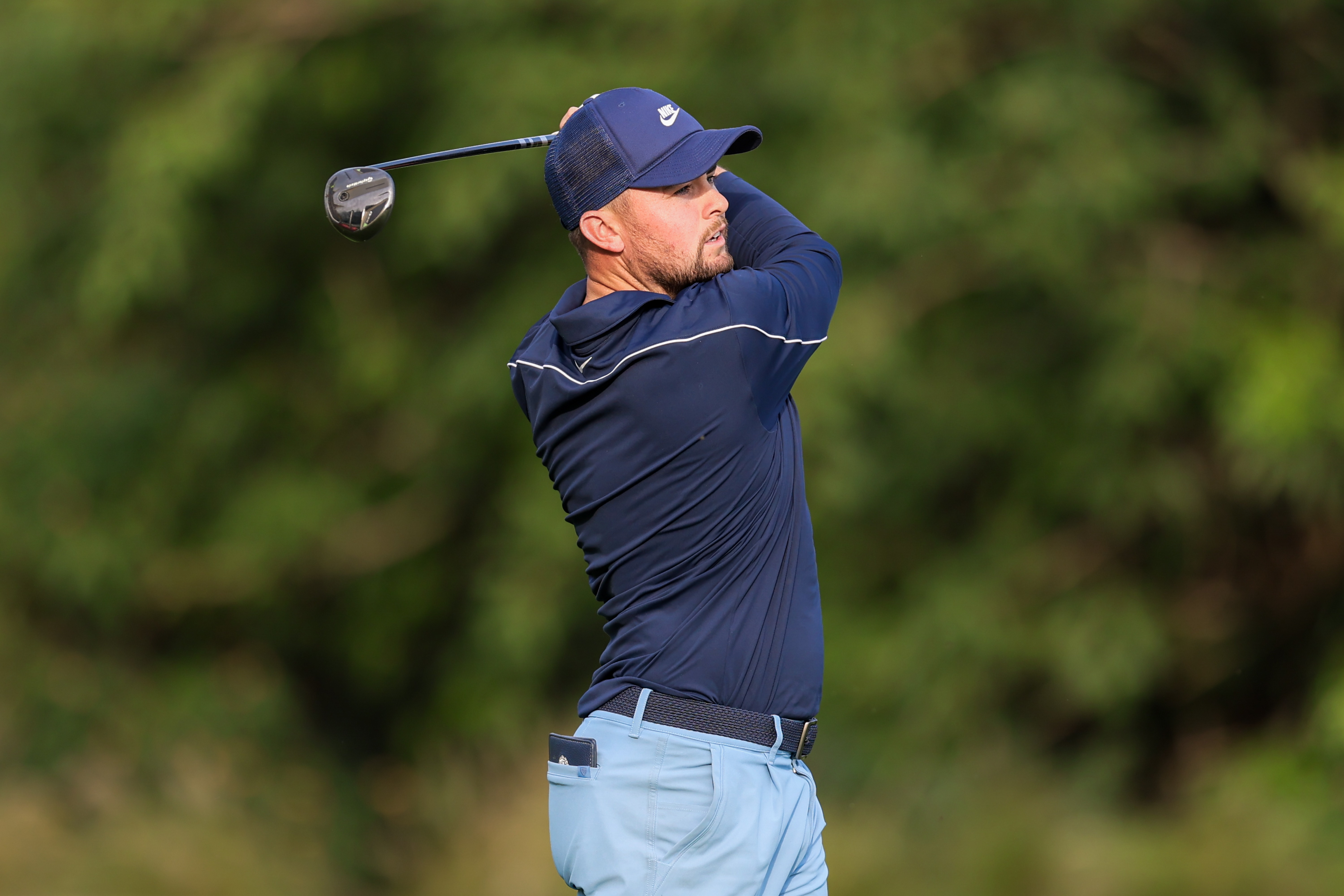 Alex Fitzpatrick plays his approach on hole 18 on day three of the Hero Indian Open