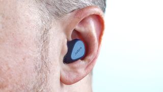 Close-up of Jabra Elite 4 earbud in ear.