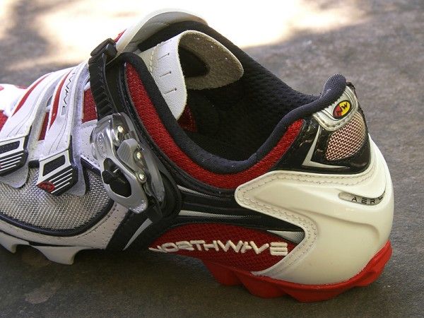 A polyurethane cage wraps the rear of the foot for exceptional heel hold, even when walking