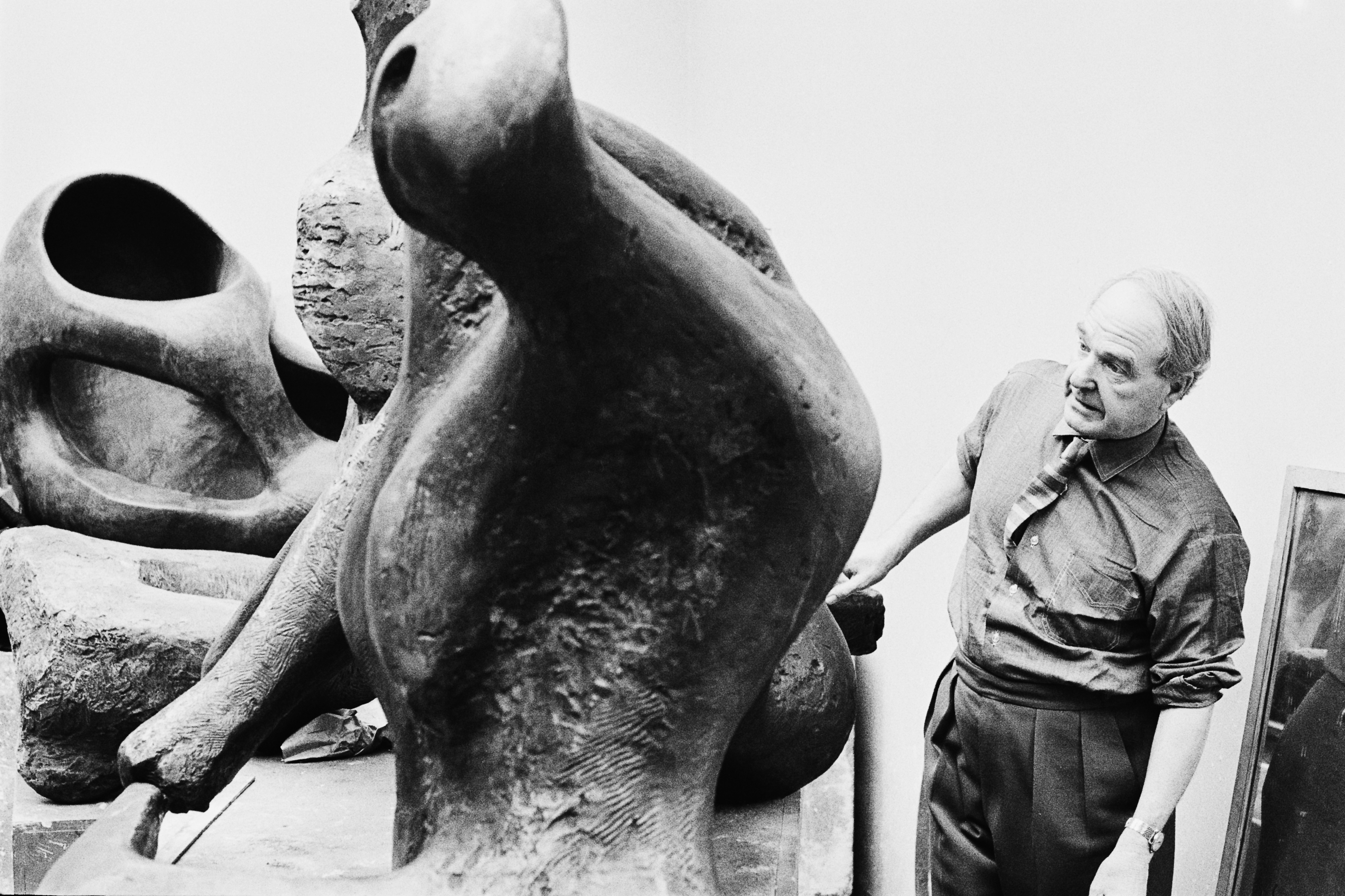 English sculptor Henry Moore (1898 - 1986) at work in a studio, March 1964.