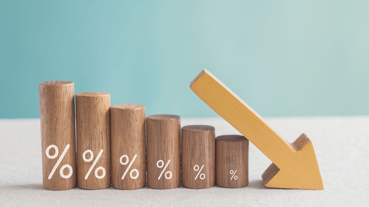 lower percentages represented on blocks with a down arrow for income tax rates