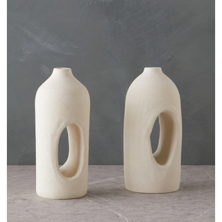 stoneware bookends in the shape of vases with hole in the middle